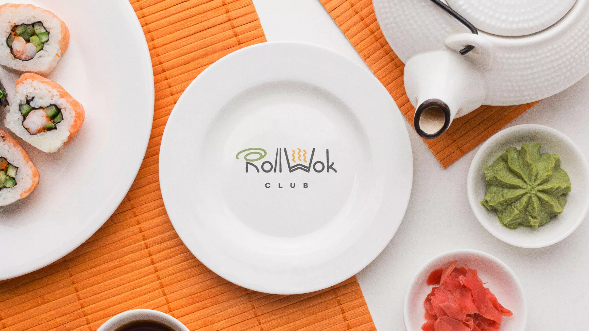Разработка логотипа и фирменного стиля в Урус-Мартане для суши-бара «Roll Wok Club» Разработка логотипа и фирменного стиля в Урус-Мартане для суши-бара «Roll Wok Club»